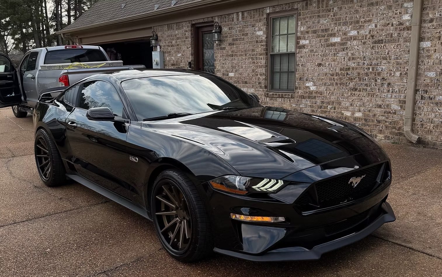 Black Ford Mustang with a glossy finish after a full detail